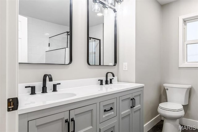 1121 E Cap Au Gris St, Troy, MO 63379 - bathroom with toilet, double vanity, baseboards, and a shower