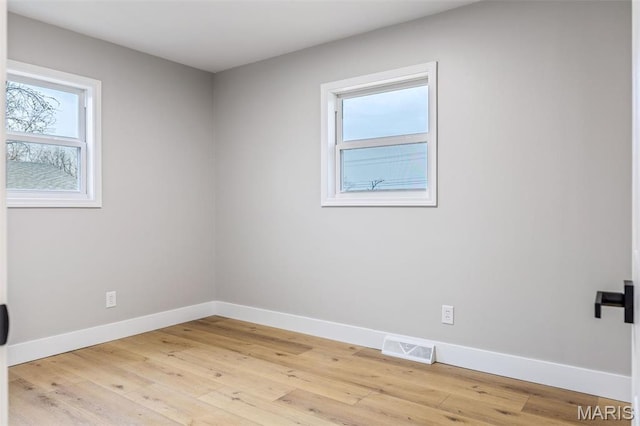 1121 E Cap Au Gris St, Troy, MO 63379 - spare room with baseboards and light wood finished floors