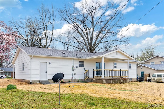 1121 E Cap Au Gris St, Troy, MO 63379 - back of house featuring a lawn, covered porch, and a shingled roof