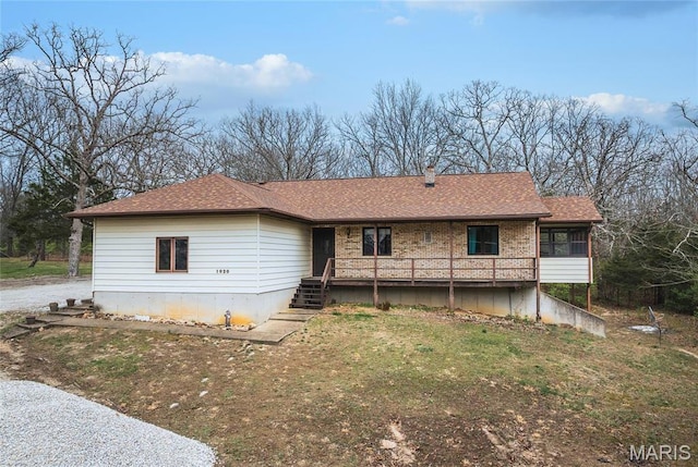 1020 White Hawk Dr, Cuba, MO 65453 - rear view of property featuring a sunroom, a lawn, stairway, and roof with shingles