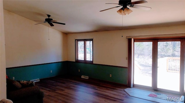1020 White Hawk Dr, Cuba, MO 65453 - unfurnished living room featuring ceiling fan, wood finished floors, and baseboards
