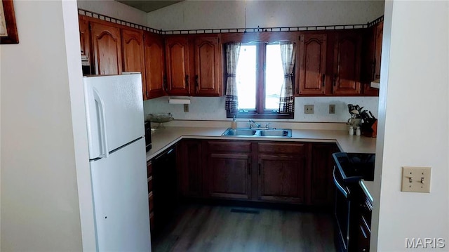 1020 White Hawk Dr, Cuba, MO 65453 - kitchen with a sink, freestanding refrigerator, stove, light countertops, and wood finished floors