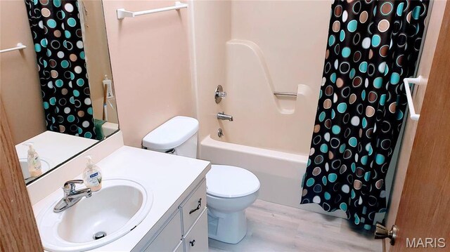 1020 White Hawk Dr, Cuba, MO 65453 - full bathroom with toilet, vanity, shower / bath combination with curtain, and wood finished floors