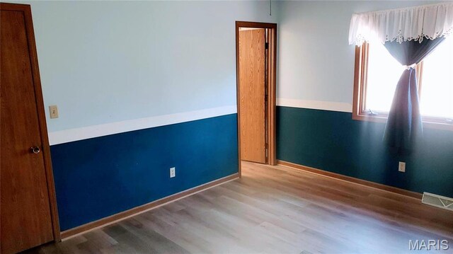 1020 White Hawk Dr, Cuba, MO 65453 - unfurnished room with wood finished floors and baseboards