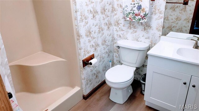 1020 White Hawk Dr, Cuba, MO 65453 - full bathroom featuring wallpapered walls, wood finished floors, vanity, a shower, and toilet