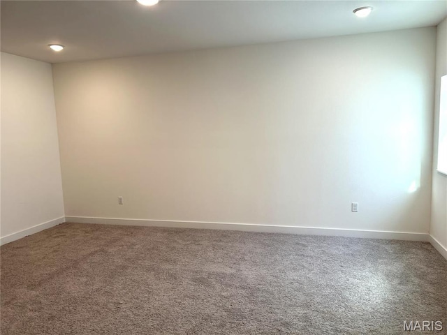 spare room with carpet flooring and baseboards