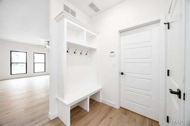 mudroom with light wood-type flooring, a ceiling fan, and baseboards