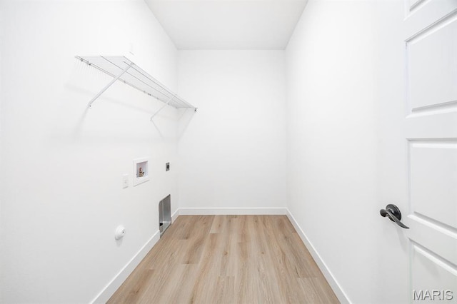 laundry room featuring hookup for a washing machine, light wood-style floors, electric dryer hookup, and baseboards
