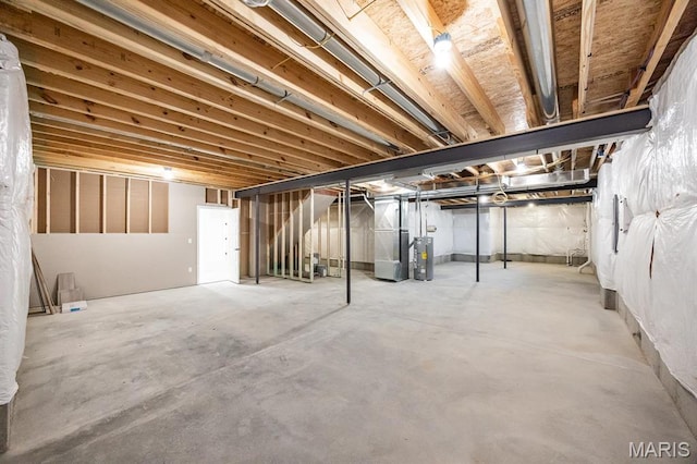 unfinished basement with heating unit, water heater, and stairs