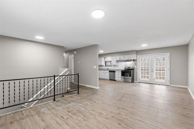 1680 Neff Rd, Saint Clair, MO 63077 - unfurnished living room with light wood-type flooring, baseboards, and recessed lighting