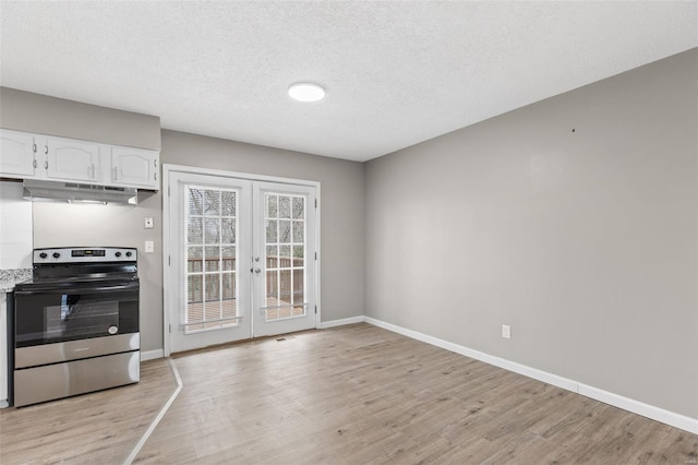 1680 Neff Rd, Saint Clair, MO 63077 - kitchen with stainless steel range with electric cooktop, under cabinet range hood, french doors, light wood-style floors, and a textured ceiling