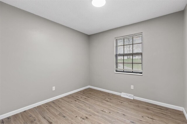1680 Neff Rd, Saint Clair, MO 63077 - spare room featuring baseboards and light wood-style flooring
