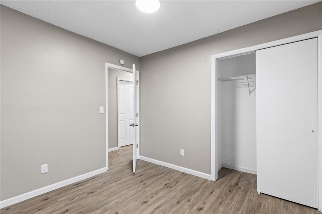 1680 Neff Rd, Saint Clair, MO 63077 - unfurnished bedroom featuring light wood-type flooring, a closet, and baseboards