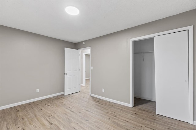 1680 Neff Rd, Saint Clair, MO 63077 - unfurnished bedroom with light wood-style flooring, baseboards, and a closet