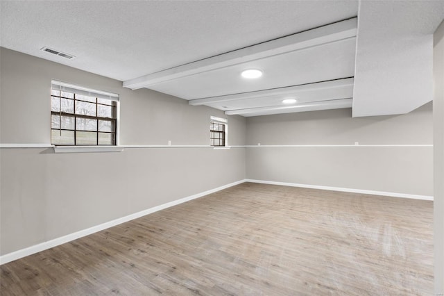 1680 Neff Rd, Saint Clair, MO 63077 - basement with baseboards, wood finished floors, healthy amount of natural light, recessed lighting, and a textured ceiling