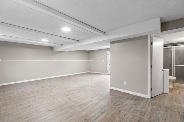 1680 Neff Rd, Saint Clair, MO 63077 - finished basement with wood finished floors, baseboards, a textured ceiling, and recessed lighting