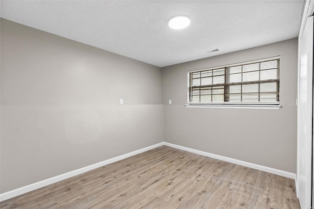 1680 Neff Rd, Saint Clair, MO 63077 - spare room with wood finished floors, baseboards, and a textured ceiling