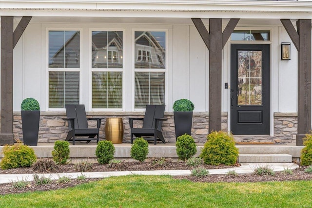 914 Memsie Park Ct, Ofallon, MO 63368 - property entrance with a porch, stone siding, and board and batten siding