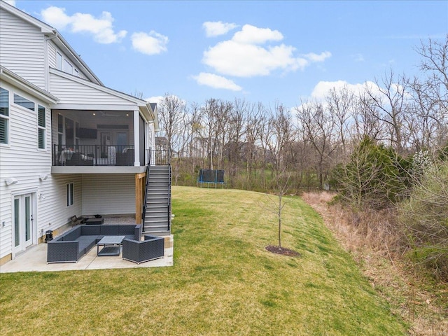 914 Memsie Park Ct, Ofallon, MO 63368 - view of grassy yard featuring a trampoline, a patio area, stairs, an outdoor hangout area, and a sunroom