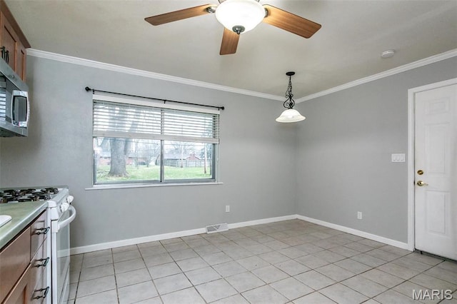 28 Countryside Ln, Fairview Heights, IL 62208 - kitchen featuring white gas stove, crown molding, stainless steel microwave, ceiling fan, and pendant lighting