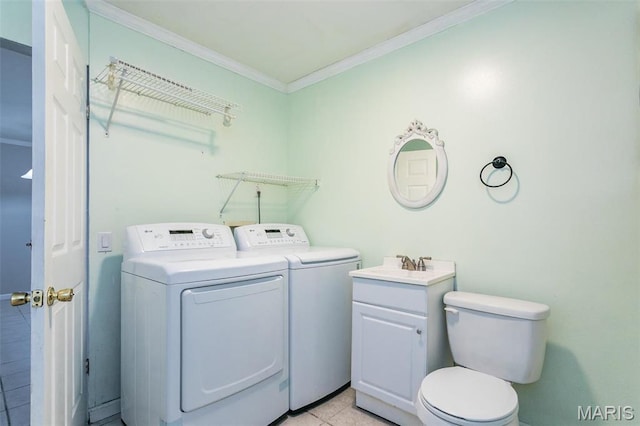 28 Countryside Ln, Fairview Heights, IL 62208 - clothes washing area with washer and clothes dryer, ornamental molding, and light tile patterned flooring