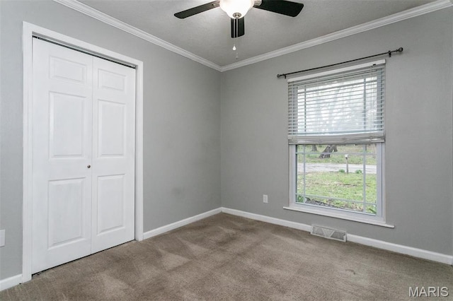 28 Countryside Ln, Fairview Heights, IL 62208 - unfurnished bedroom with multiple windows, carpet flooring, ornamental molding, baseboards, and a closet