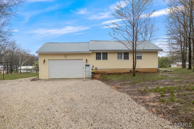 34441 Hickory Hills Rd, Mo, MO 65078 - rear view of house featuring a garage, driveway, and metal roof