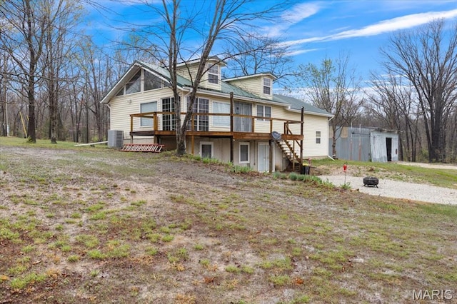 34441 Hickory Hills Rd, Mo, MO 65078 - back of house with a deck, stairway, a fire pit, central AC unit, and an outdoor structure