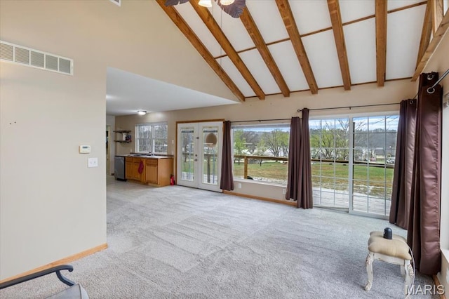 34441 Hickory Hills Rd, Mo, MO 65078 - unfurnished living room with high vaulted ceiling, light colored carpet, baseboards, and beamed ceiling
