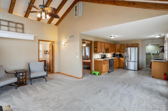 34441 Hickory Hills Rd, Mo, MO 65078 - kitchen with stainless steel appliances, ceiling fan, light colored carpet, high vaulted ceiling, and beamed ceiling