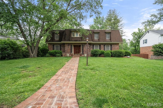 10221 Lylewood Dr, Ladue, MO 63124 - view of property with mansard roof, a front lawn, brick siding, and roof with shingles
