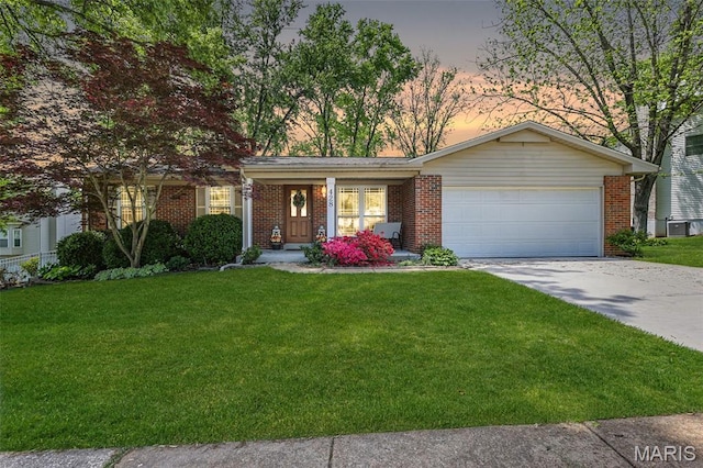 428 Melanie Meadows Ln, Ballwin, MO 63021 - single story home with an attached garage, a front lawn, driveway, and brick siding