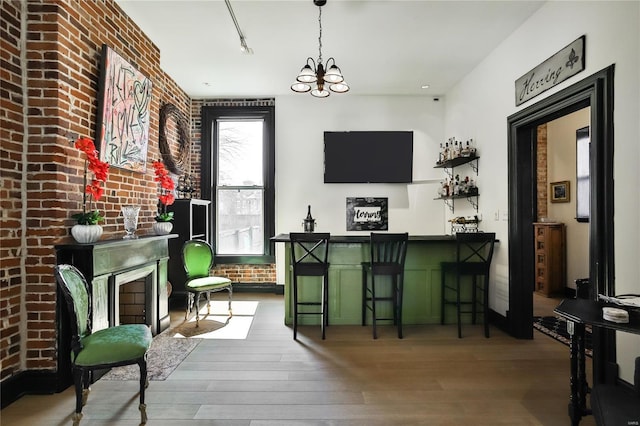 910 Lami St, Saint Louis, MO 63104 - indoor dry bar featuring hardwood / wood-style flooring, a chandelier, and hanging light fixtures