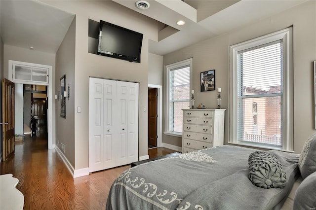 910 Lami St, Saint Louis, MO 63104 - bedroom with wood finished floors, baseboards, a closet, and recessed lighting