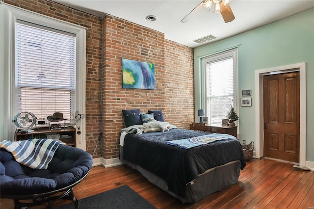 910 Lami St, Saint Louis, MO 63104 - bedroom featuring hardwood / wood-style floors, baseboards, brick wall, and ceiling fan