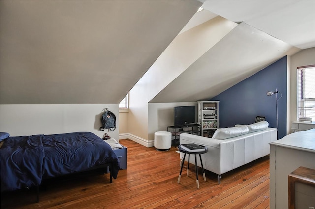 910 Lami St, Saint Louis, MO 63104 - bedroom featuring hardwood / wood-style flooring, vaulted ceiling, and baseboards