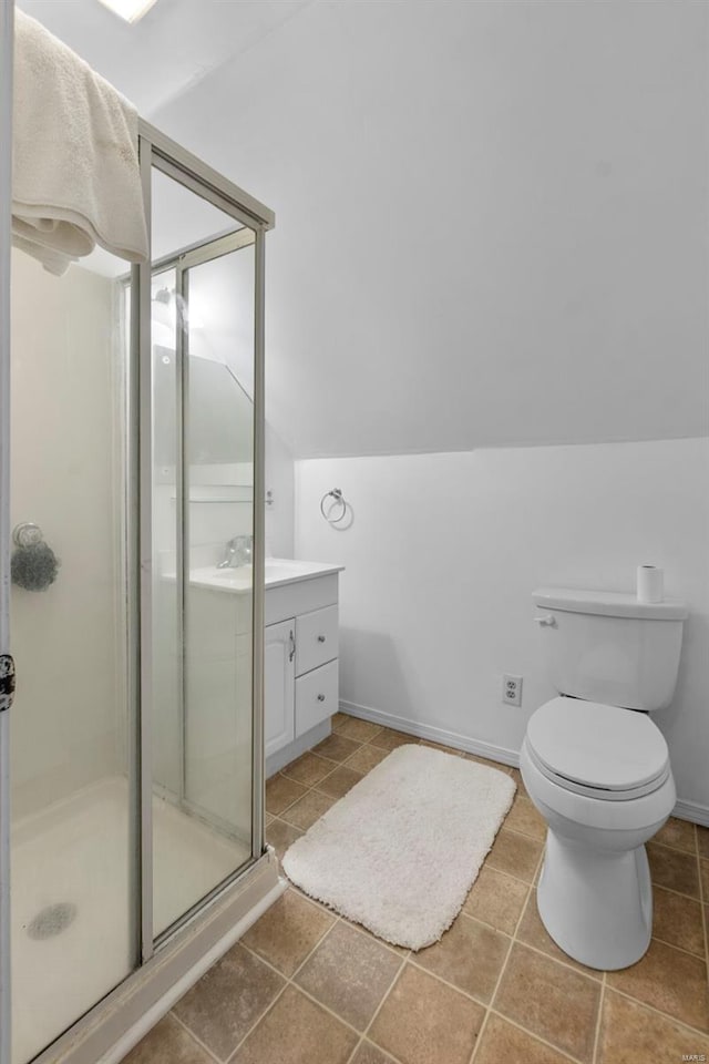 312 Bellevue St, Cape Girardeau, MO 63701 - bathroom with a stall shower, vanity, toilet, and baseboards