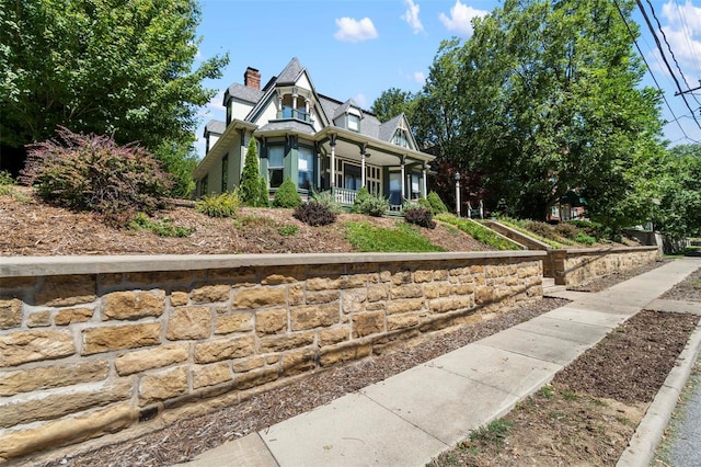 312 Bellevue St, Cape Girardeau, MO 63701 - view of front of property with a porch and a chimney