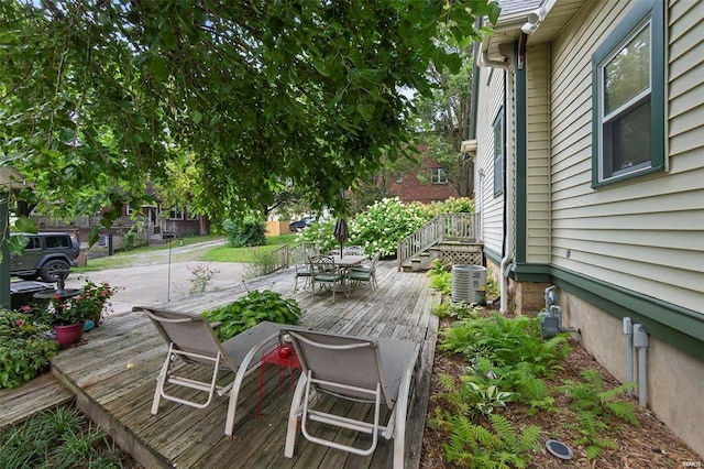 312 Bellevue St, Cape Girardeau, MO 63701 - wooden deck featuring outdoor dining space and central AC unit