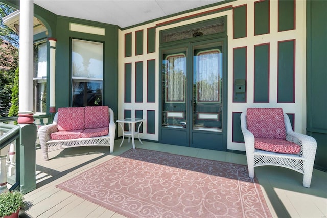 312 Bellevue St, Cape Girardeau, MO 63701 - view of exterior entry featuring french doors and covered porch
