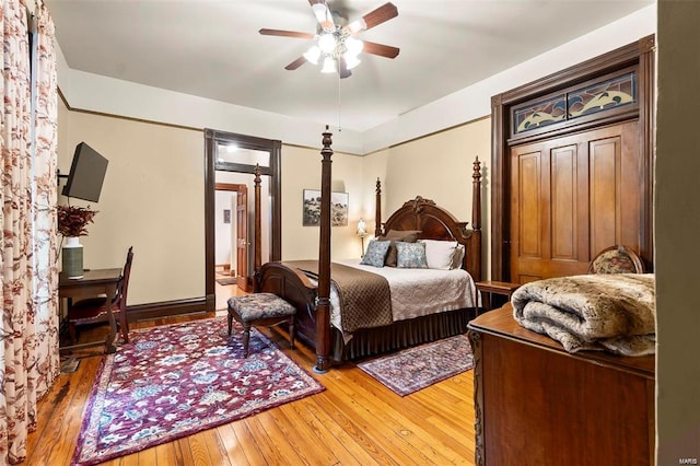 312 Bellevue St, Cape Girardeau, MO 63701 - bedroom with light wood-style flooring, ceiling fan, and baseboards