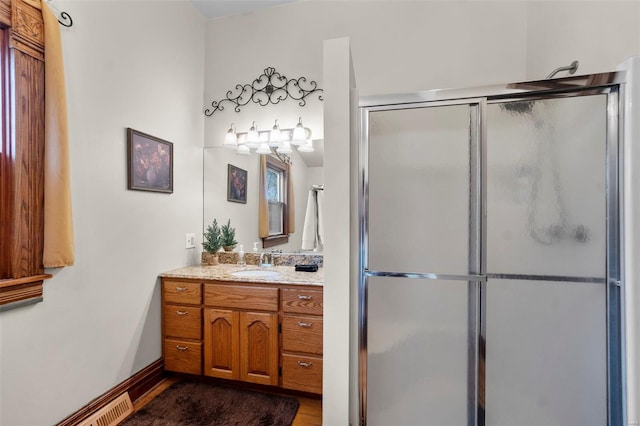312 Bellevue St, Cape Girardeau, MO 63701 - bathroom featuring a stall shower, vanity, and wood finished floors