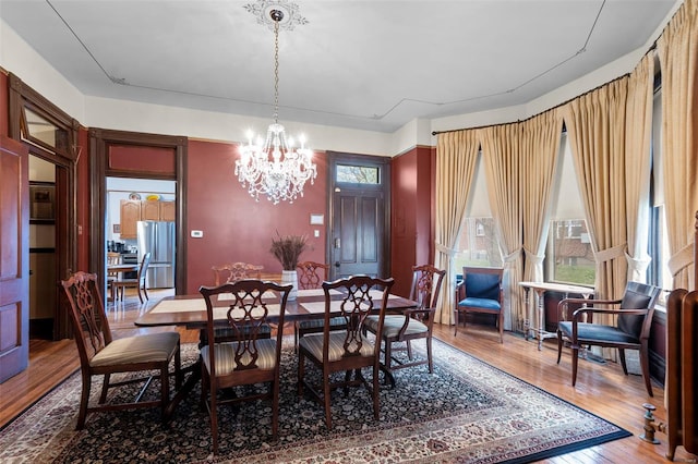 312 Bellevue St, Cape Girardeau, MO 63701 - dining area with a chandelier and wood finished floors