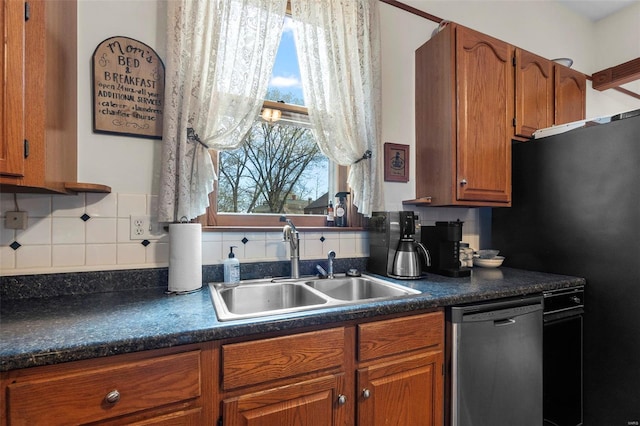 312 Bellevue St, Cape Girardeau, MO 63701 - kitchen featuring dishwasher, a sink, dark countertops, brown cabinets, and tasteful backsplash