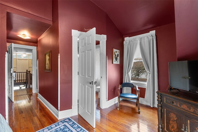 312 Bellevue St, Cape Girardeau, MO 63701 - hallway featuring hardwood / wood-style floors, lofted ceiling, and baseboards