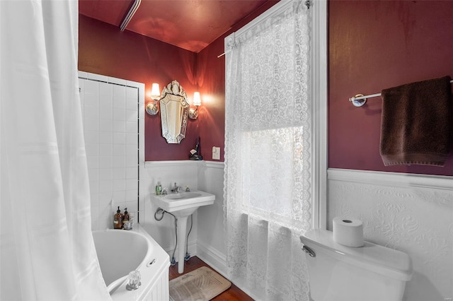 312 Bellevue St, Cape Girardeau, MO 63701 - bathroom with shower / bath combo with shower curtain, toilet, and a sink