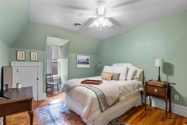 312 Bellevue St, Cape Girardeau, MO 63701 - bedroom featuring vaulted ceiling, wood finished floors, a ceiling fan, and baseboards