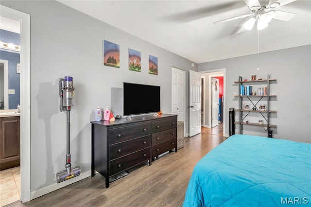 745 Sugar Glen Dr Unit 5, Saint Peters, MO 63376 - bedroom featuring wood finished floors, baseboards, ensuite bathroom, and ceiling fan