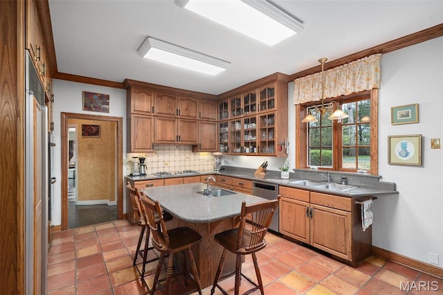 8 Carrswold Dr, Clayton, MO 63105 - kitchen with stainless steel appliances, a sink, decorative backsplash, brown cabinets, and ornamental molding