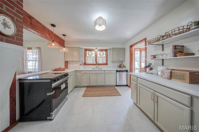 1003 S Warfel St, Salem, MO 65560 - kitchen featuring electric stove, dishwasher, a sink, decorative light fixtures, and light countertops